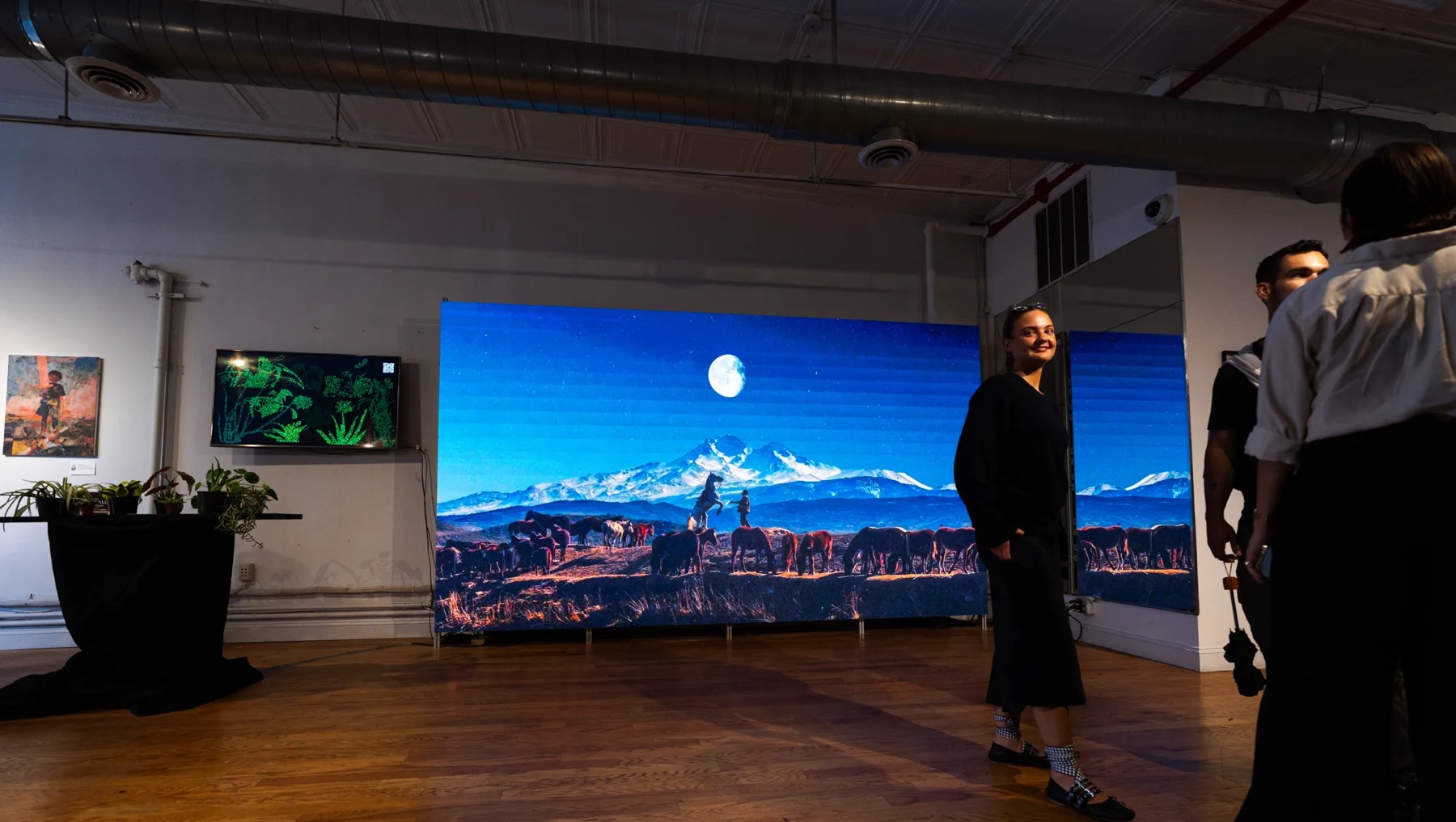 White-walled gallery loft with hardwood floors